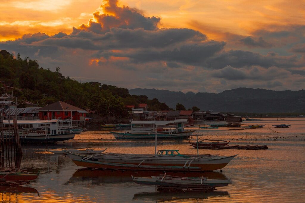 port, nature, boats, sunset, dusk, bay, sea, water, water reflection, wooden boats, harbor, scenery, countryside, island, philippines-5670110.jpg